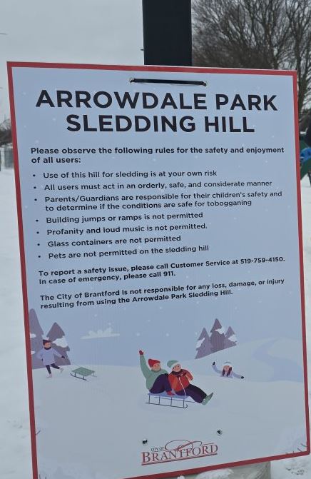 Sign showing rules if you toboggan at Arrowdale Park in Brantford, Ontario